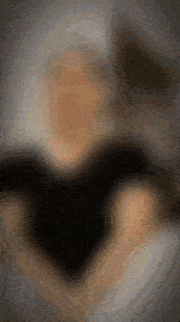 a close up of a person 's face with a blurry background
