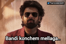 a man with a beard wears sunglasses and says bandi konchem melaga