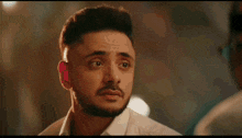 a man and a woman are looking at each other and the woman has glasses on