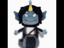 a stuffed toy with a horn on its head