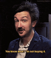 a man with his eyes closed says " you know what ? i 'm not buying it "