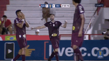 a soccer player wearing a jbs jersey celebrates