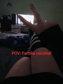 a person laying on a bed with the words pov familia csicsikal written above them