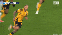 a soccer player is running on the field with the scoreboard showing 44:40