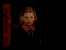 a woman is standing in front of a sign that says ' 43 ' on it
