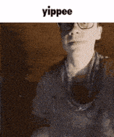 a picture of a man with glasses and the word yippee on top