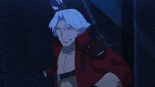 a man with white hair and a red jacket is standing next to another man
