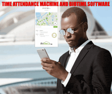 a man in a suit is looking at his phone with the words time attendance machine and biotime software written below him