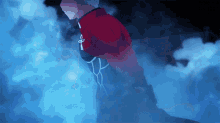 a man in a red cape is standing in a dark room