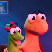 a couple of cartoon characters sitting on a couch looking at something