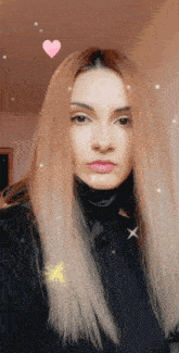 a woman with long blonde hair is wearing a black top