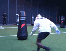 a person is jumping in front of a mvp sprint bag
