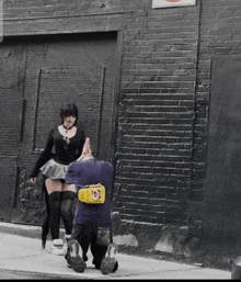 a person with a yellow spongebob bag on their back walks down the street