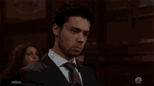 a man in a suit and tie is on nbc tv