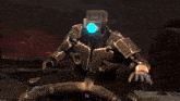 a robot is shooting a gun with a red light coming out of it 's mouth