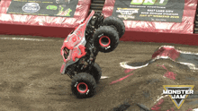 a monster jam advertisement shows a monster truck on a dirt track