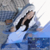 a girl in a shark costume is dancing in front of a screen that says follower my serenity