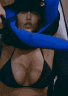 a woman 's breasts are being held by a man