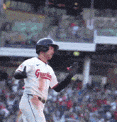 a baseball player wearing a jersey that says guardians