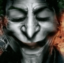 a close up of a person 's face with a joker face on it