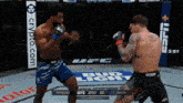 two men are fighting in a boxing ring with a bud light banner behind them