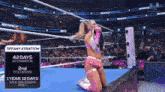 a female wrestler named tiffany stratton is kneeling down in a ring