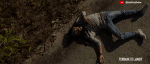 a man laying on the ground with the words terbaik langit written on the bottom