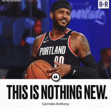 a basketball player from portland is holding a basketball in his hands