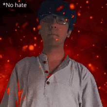 a man wearing glasses stands in front of a red background with the words " no hate " above him