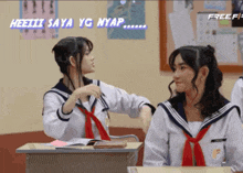 two girls in school uniforms are sitting at desks in a classroom with the words heeiiii saya yg nyap above them