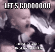 a baby is screaming in a crowd with the words let 's gooooooo sunset lakes surgery center