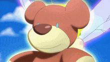 a teddy bear with wings and a blue eye