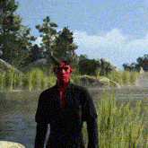 a man with red face and horns is standing next to a river
