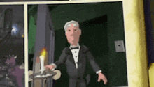 a man in a tuxedo is holding a candle in a cartoon .
