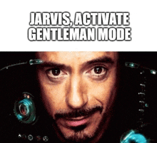 a close up of a man 's face with jarvis activated gentleman mode written above him