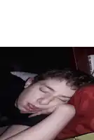 a young boy is sleeping next to a book called the king