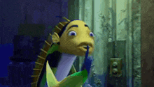 a cartoon fish with a blue tongue sticking out of its mouth .