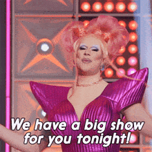 a drag queen in a purple dress says we have a big show for you tonight