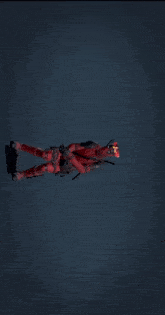 a man in a deadpool costume is flying through the air with his arms outstretched