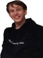 a young man wearing a black champion hoodie smiles