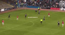 a group of soccer players on a field with academyarenauto written in the corner