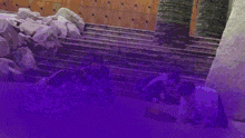 a purple and orange background with a statue in the middle