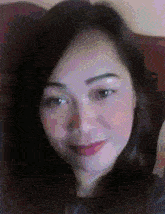 a blurry picture of a woman 's face with a purple background