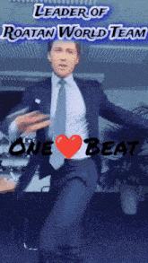 a man in a suit and tie is dancing in front of a sign that says leader of roatan world team one beat
