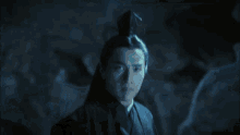 a sword is being thrown in the air in a dark room