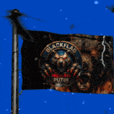 a black flag with a bear and the words black flag merah putih on it