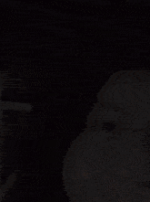 a blurry picture of a woman 's face with a slight smile on her face