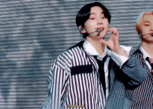 a man in a striped shirt says peach very in yellow letters