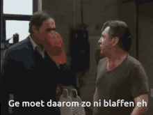 two men are standing next to each other in a room with the words ge moet daarom zo ni blaffen eh above them
