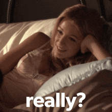 a woman laying on a bed with the word really written on the bottom